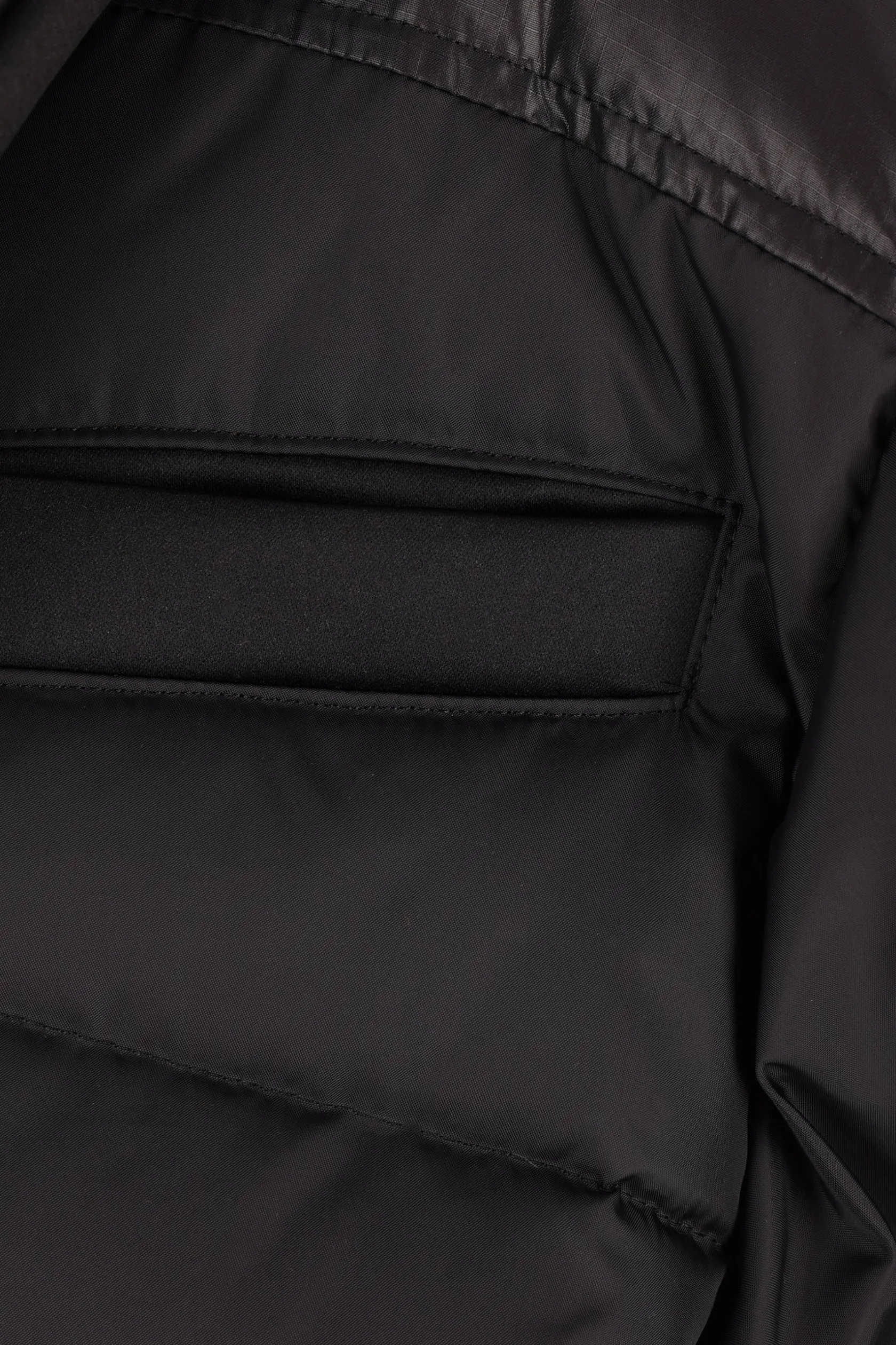 Capispalla>UNDERCOVER piumino in nylon e raso Nero